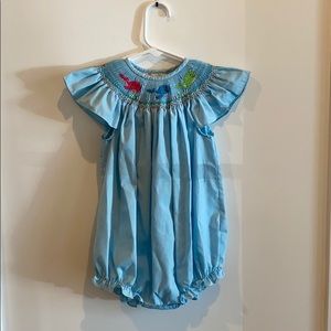 Adorable blue smocked whale bubble.